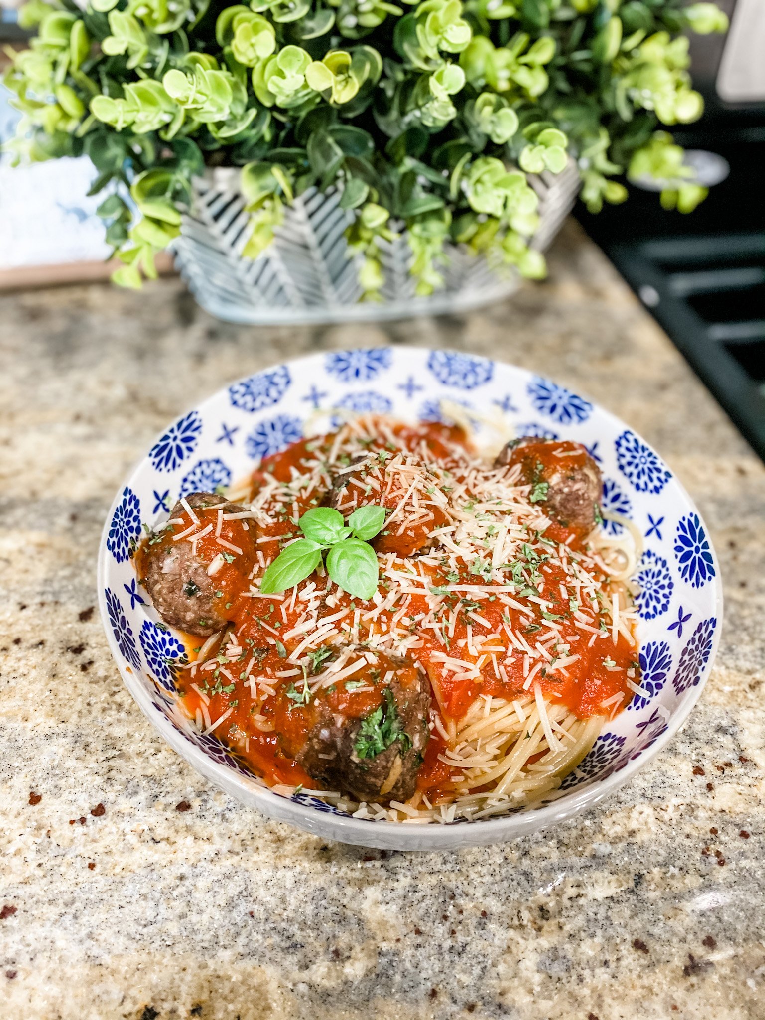 Bowl of pasta served with meatballs