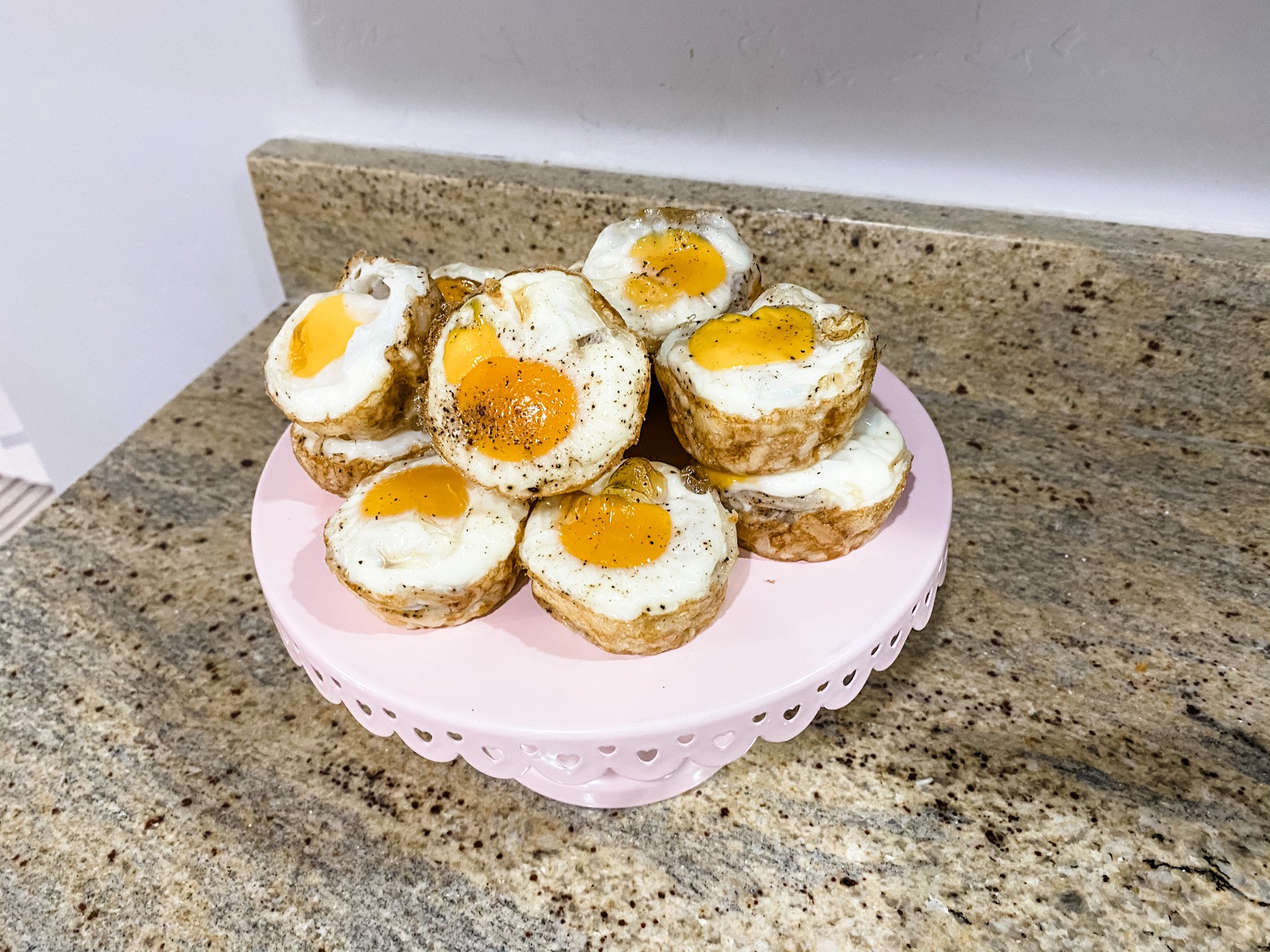 baked hashbrown egg bites stacked on plate
