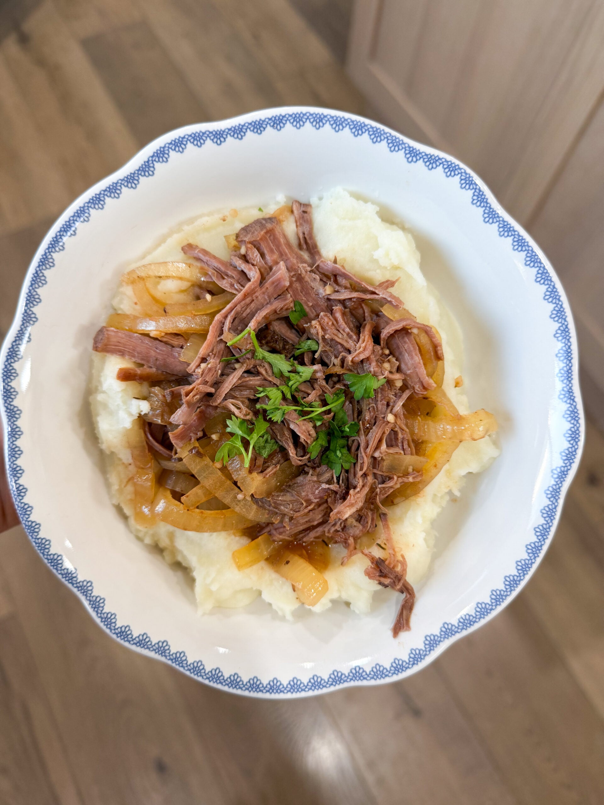 bowl of French onion pot roast with gravy