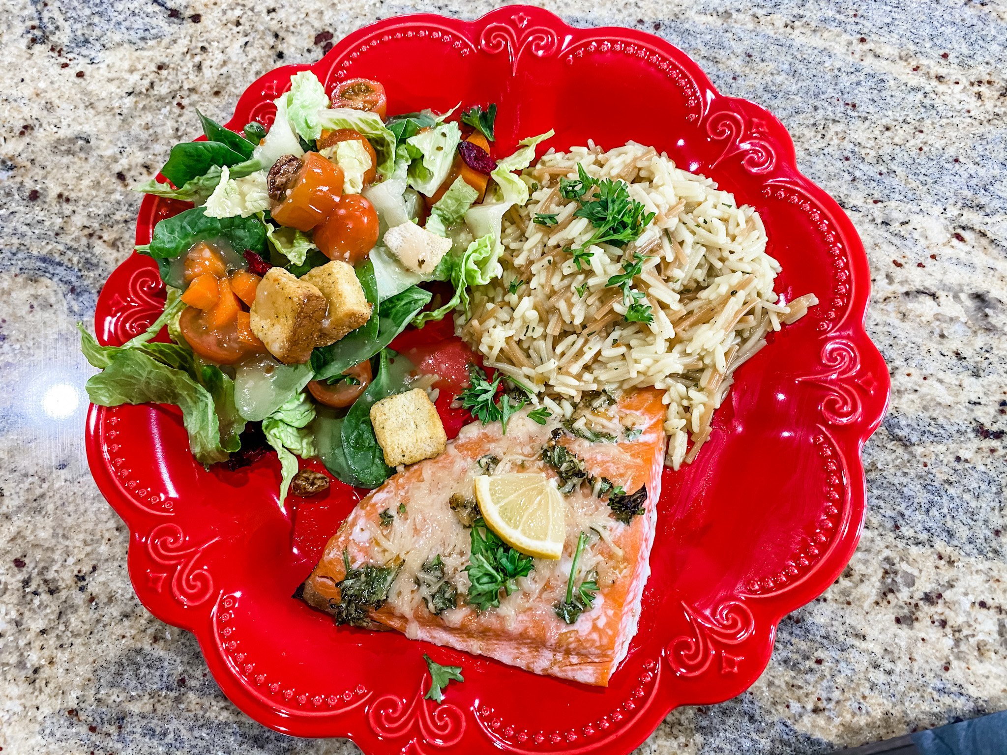 Lemon Parmesan Salmon served with rice and a salad