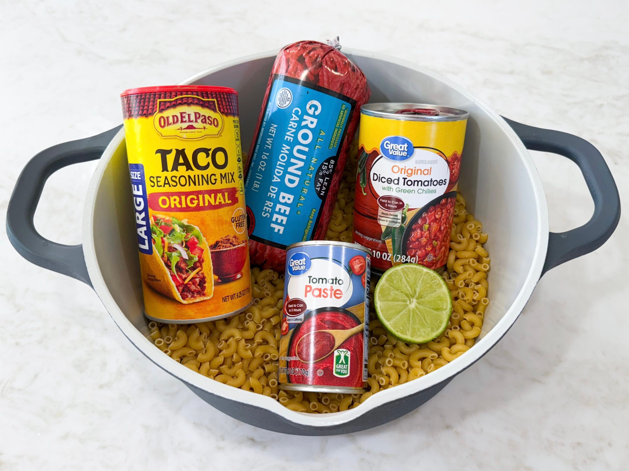 Easy Taco Pasta One Pot Skillet Dinner ingredients in a pot on the counter.