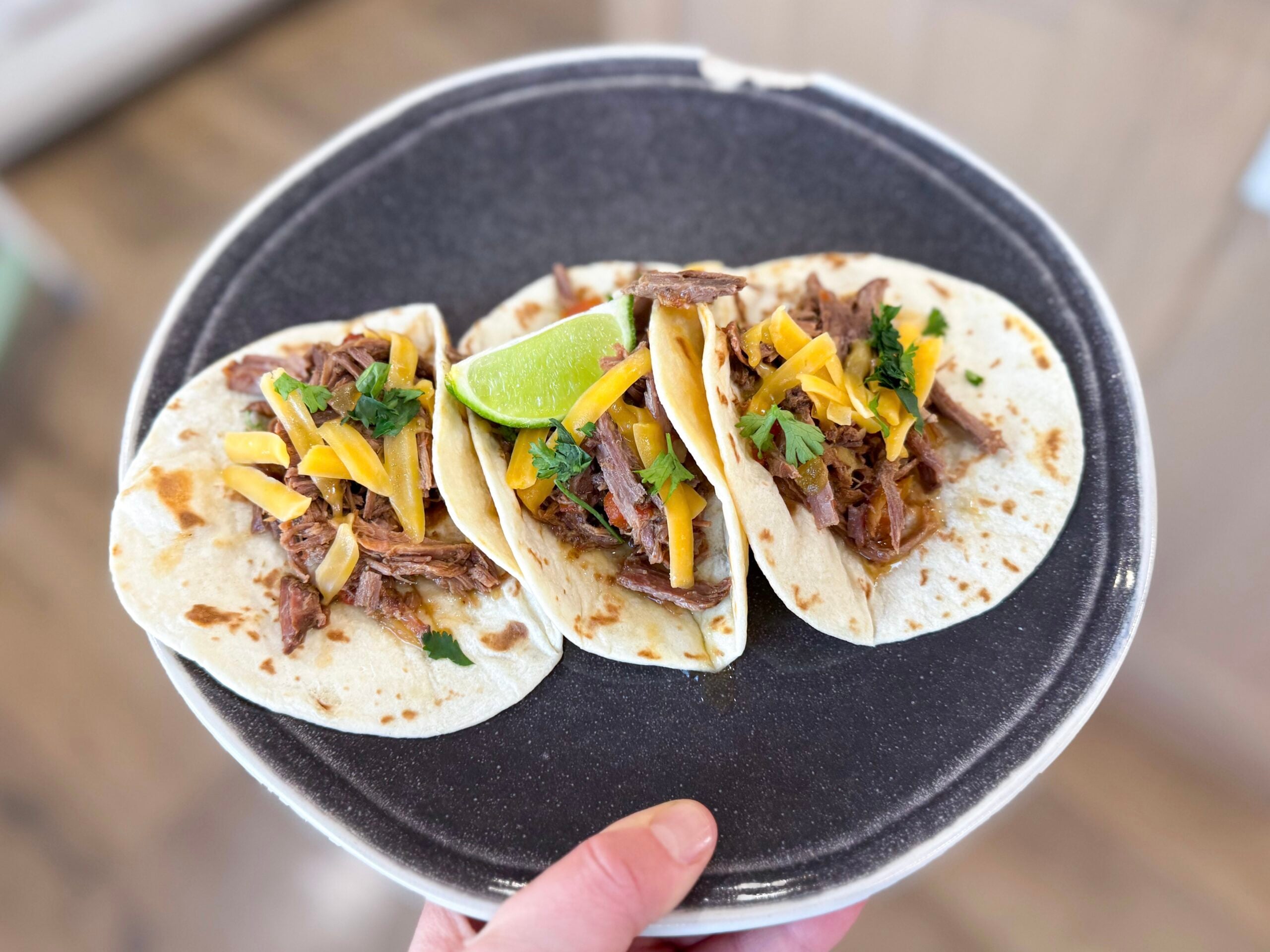 carne asada served in tortillas with toppings