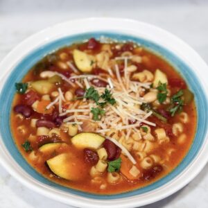 Slow cooker minestrone soup in bowl with Parmesan