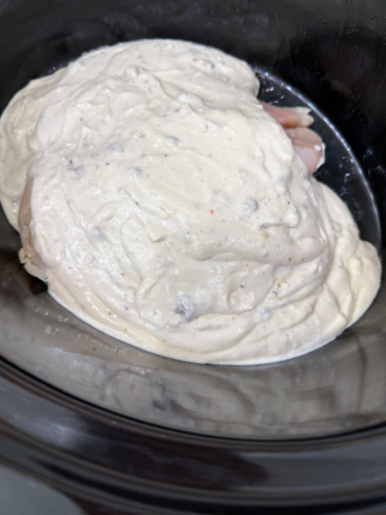 Cover chicken in creamy sauce