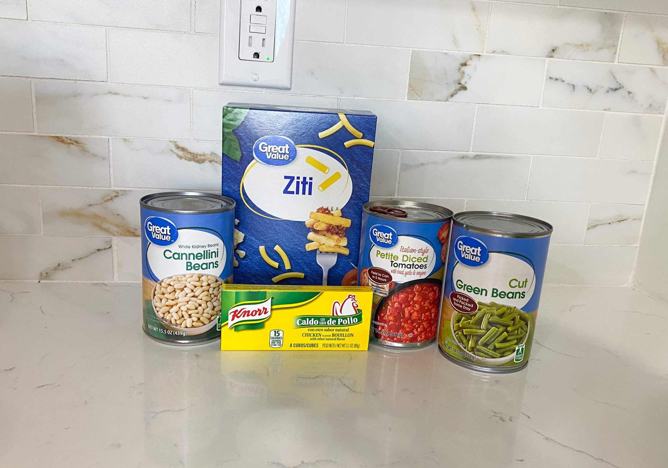 Ingredients for vegetable noodle soup including pasta, beans, and green beans