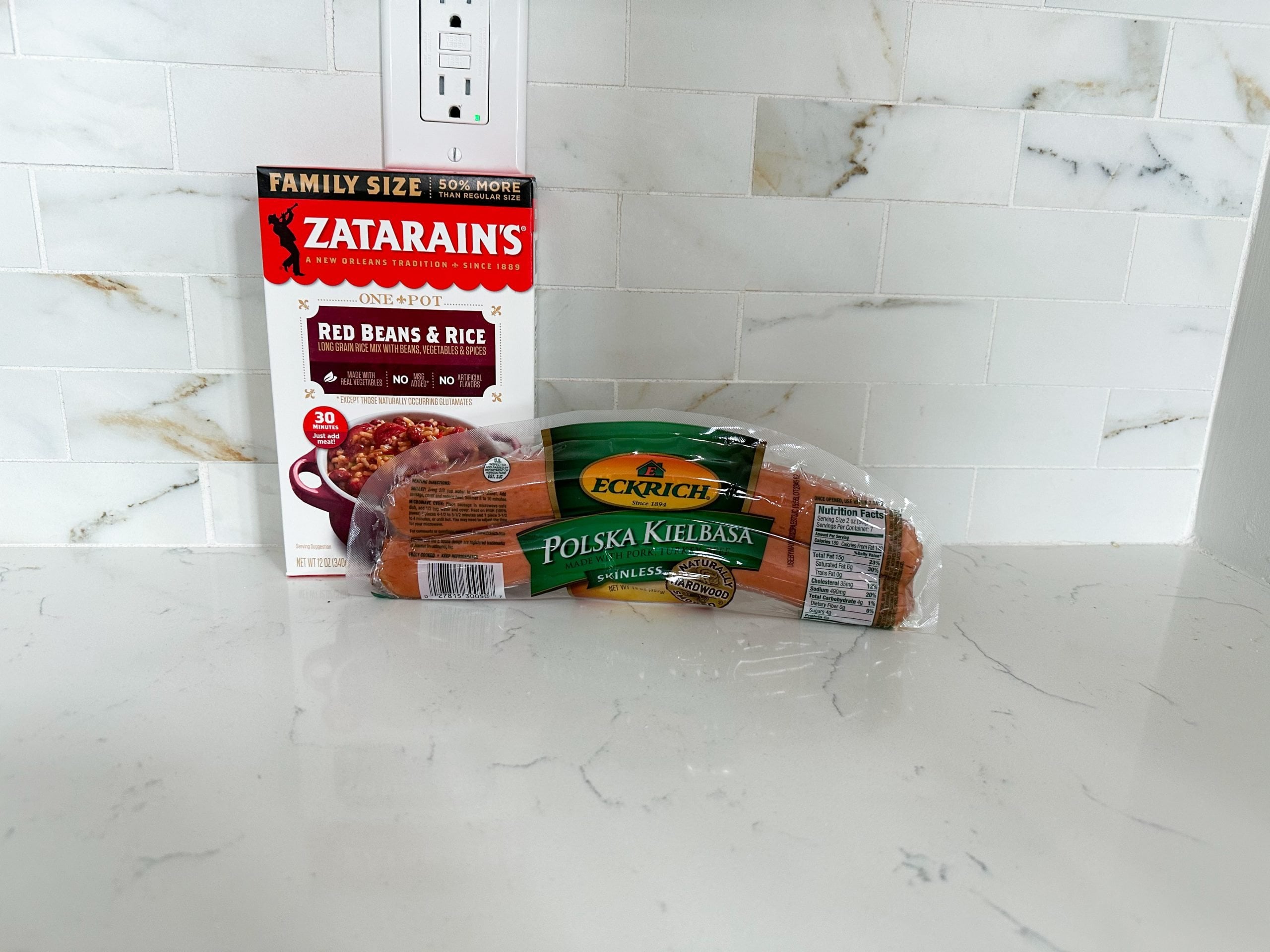 Ingredients for red beans and rice including sausage and rice mix