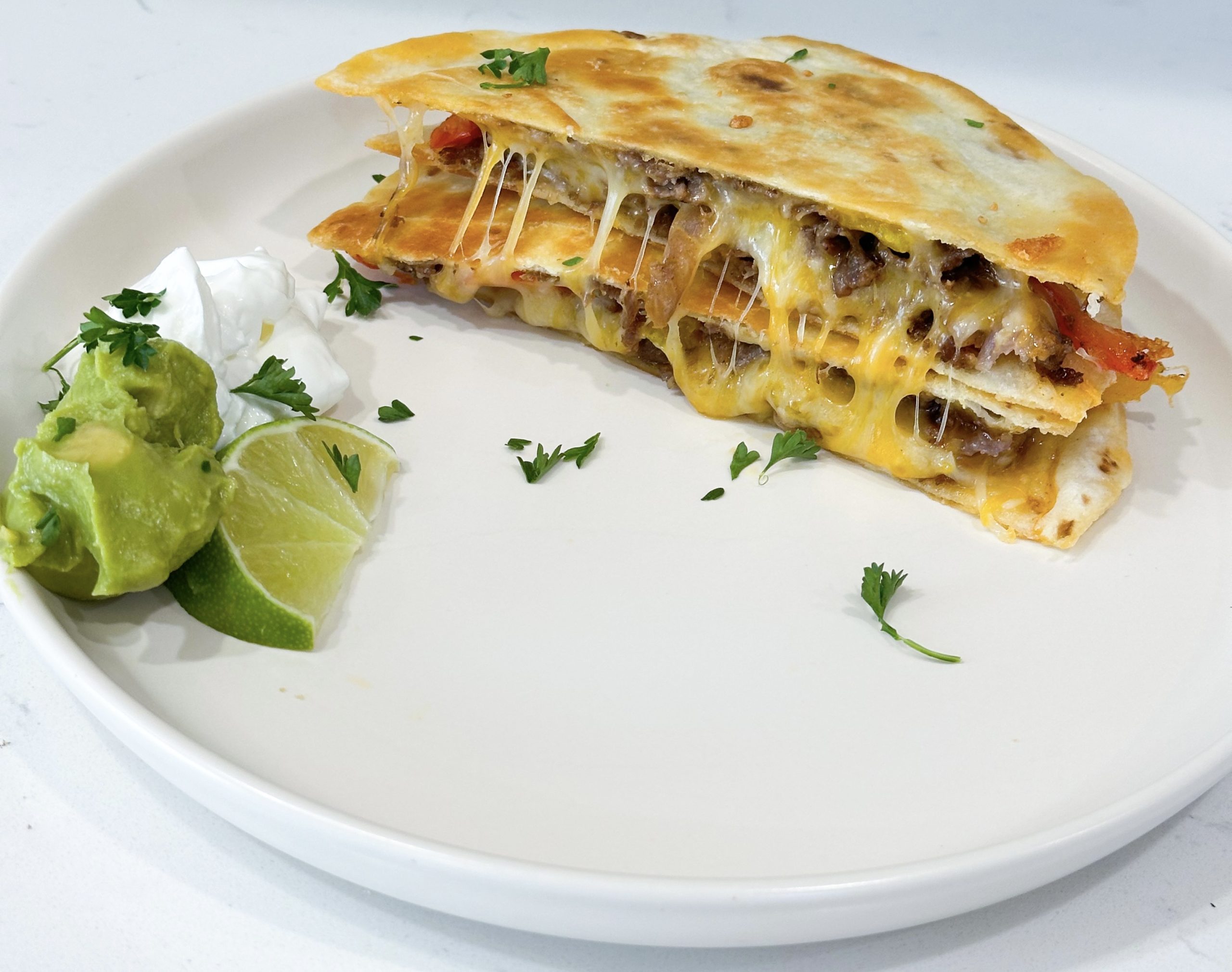 plated steak fajita quesadillas