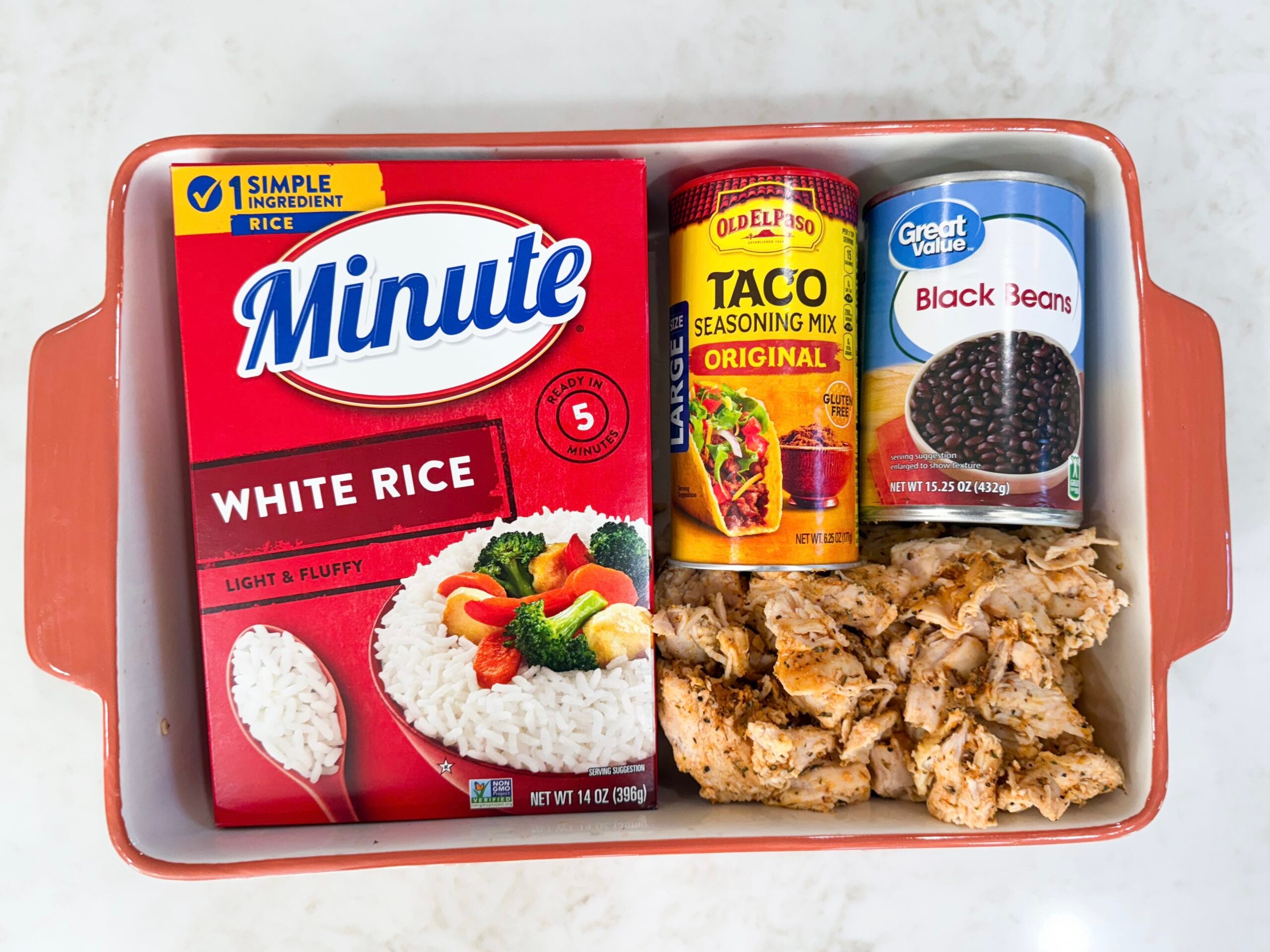 Ingredients for fiesta chicken casserole in casserole dish