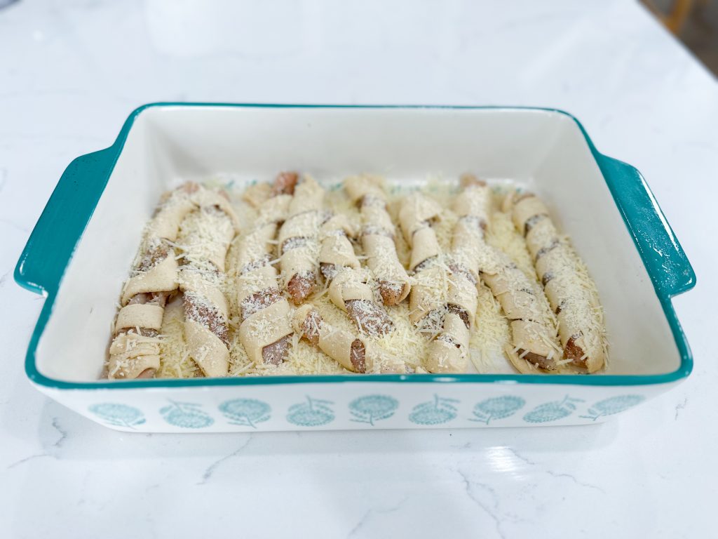Wrapped chicken placed in baking dish.