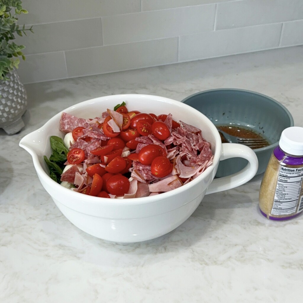 add antipasto ingredients to the bowl