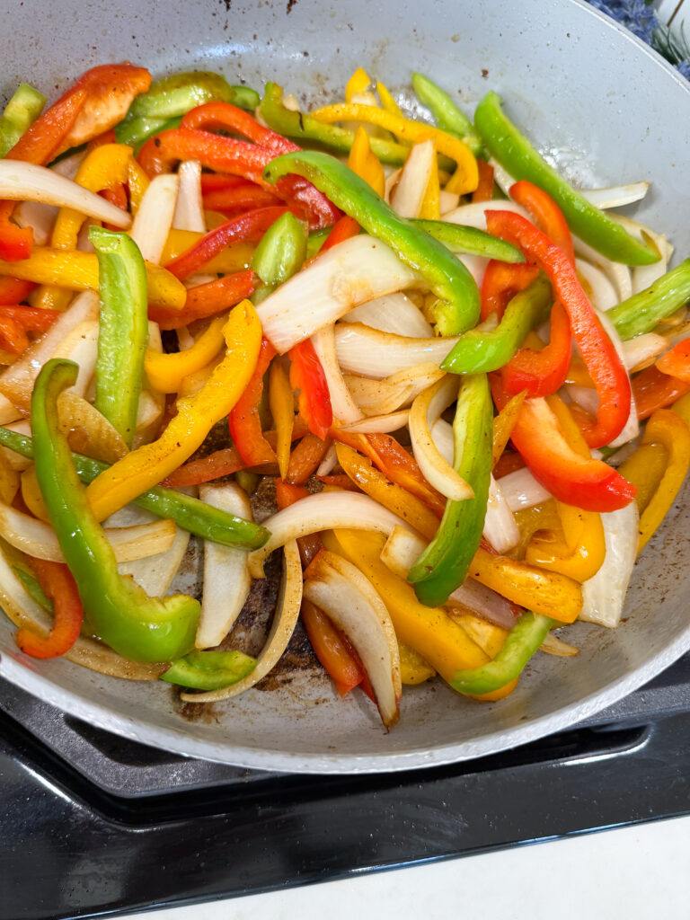 Saute peppers and onions