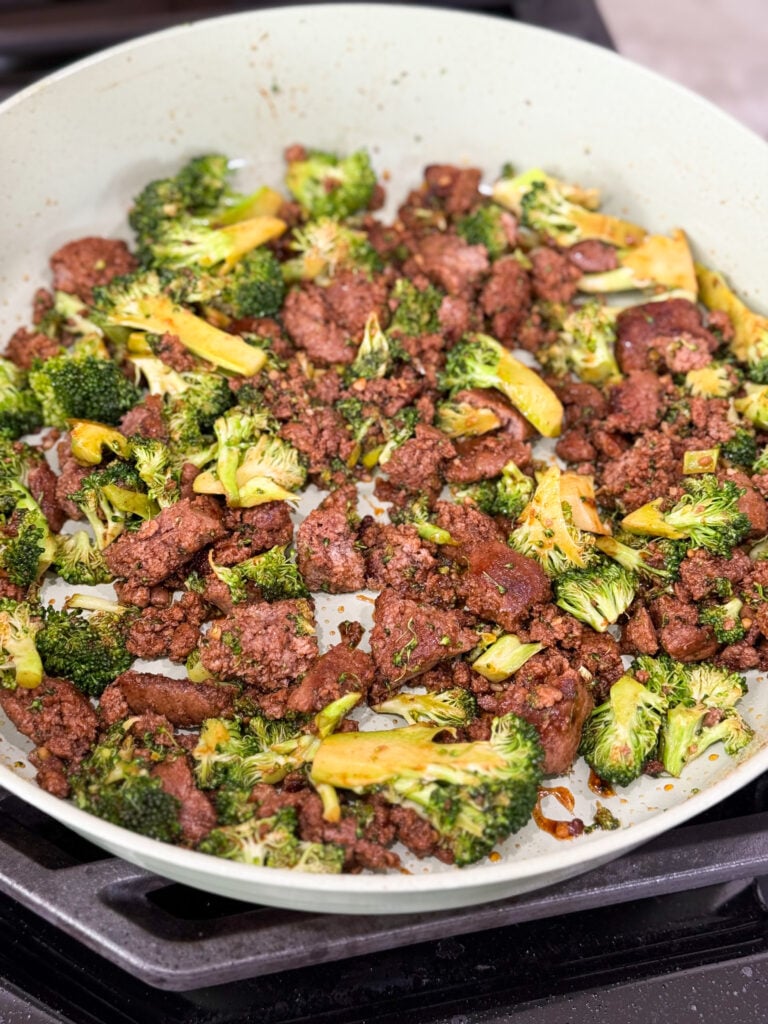Cook broccoli and ground turkey in a large skillet with seasoning