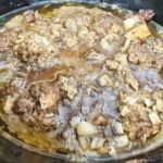 ground meat cooked in a black slow cooker