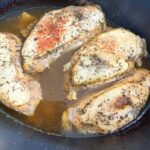 cooked seasoned chicken in a slow cooker