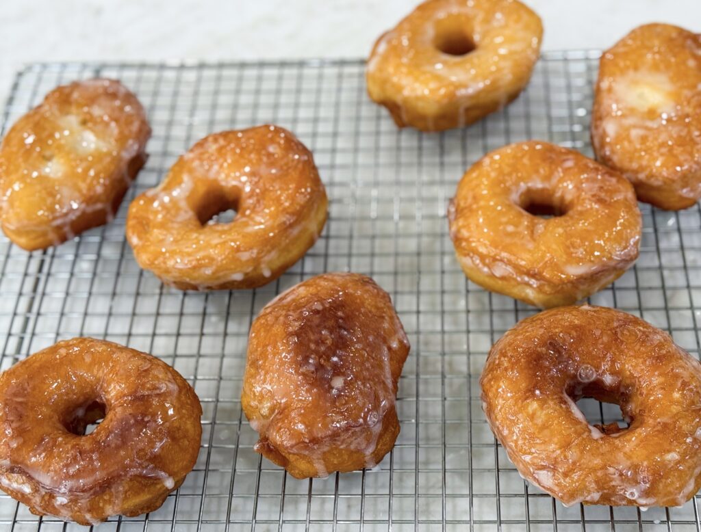 Homemade glazed donuts made from biscuit dough.
