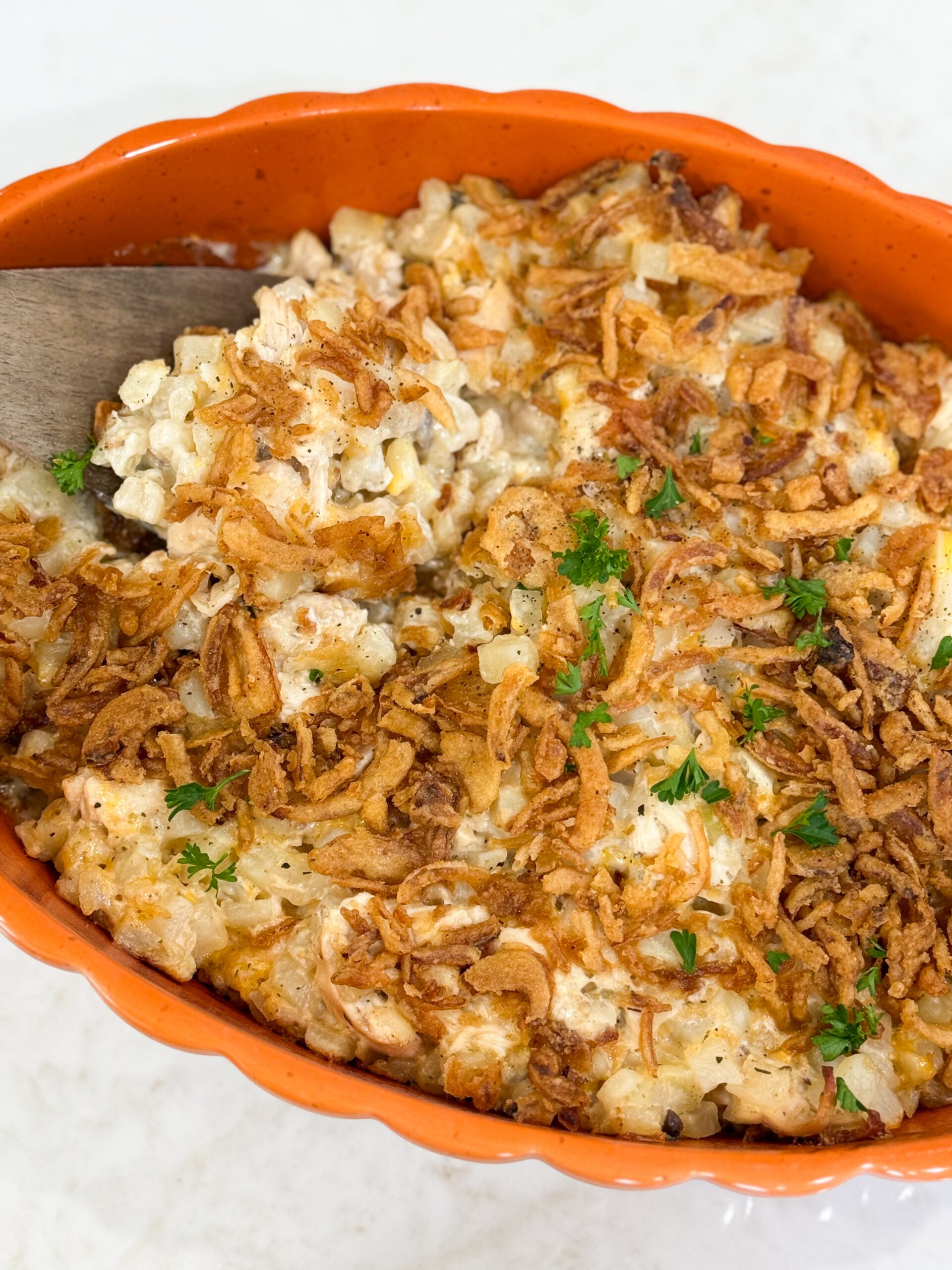 Onion Chicken Potato Casserole baked golden brown with crispy onion topping in 9x13 dish.