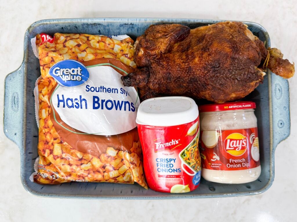 Ingredients for Onion Chicken Potato Casserole including shredded chicken, hash browns, cheddar, French onion dip, cream soup, and fried onions.