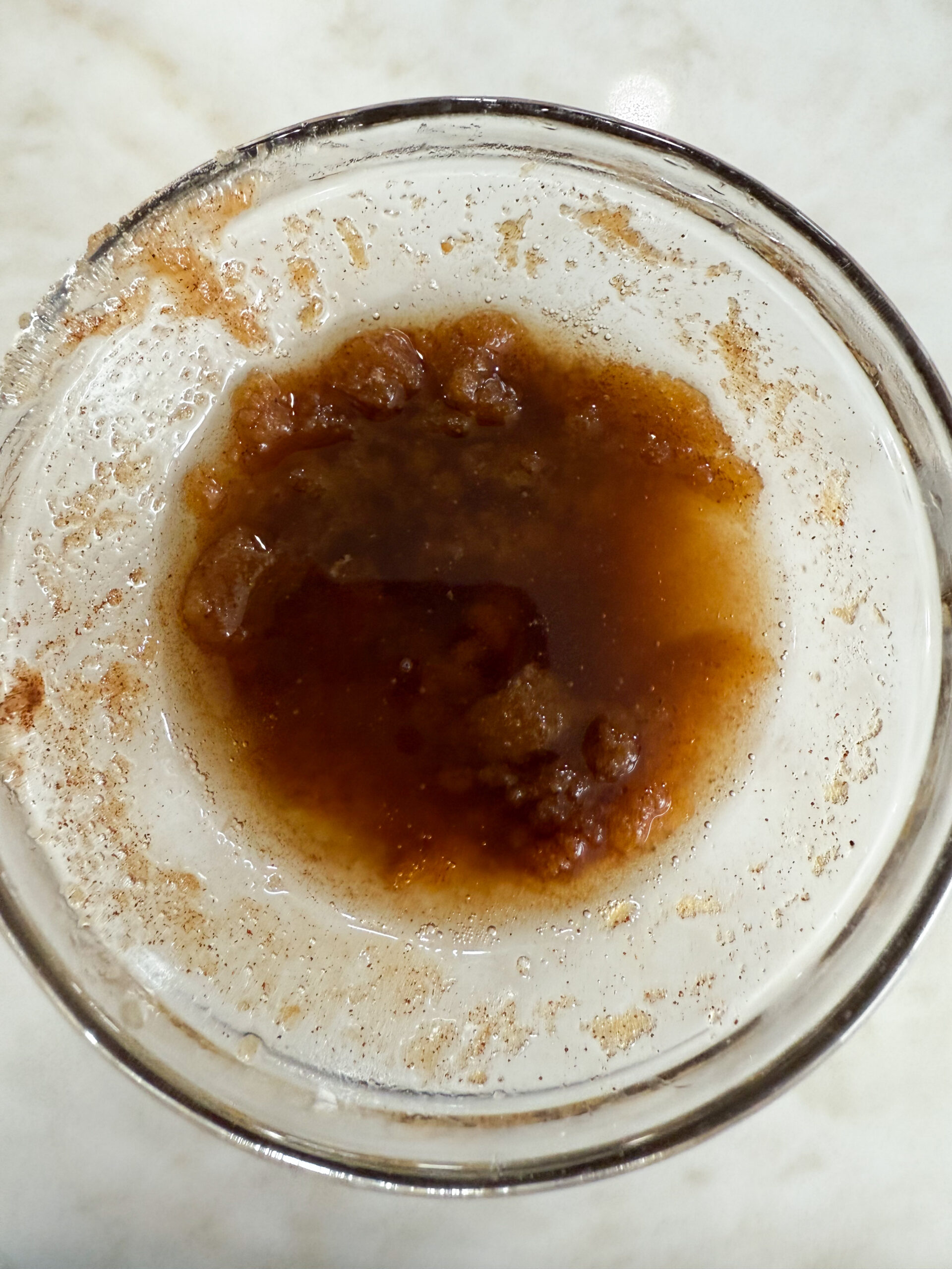 Melted butter, brown sugar, and cinnamon in a bowl for the donuts