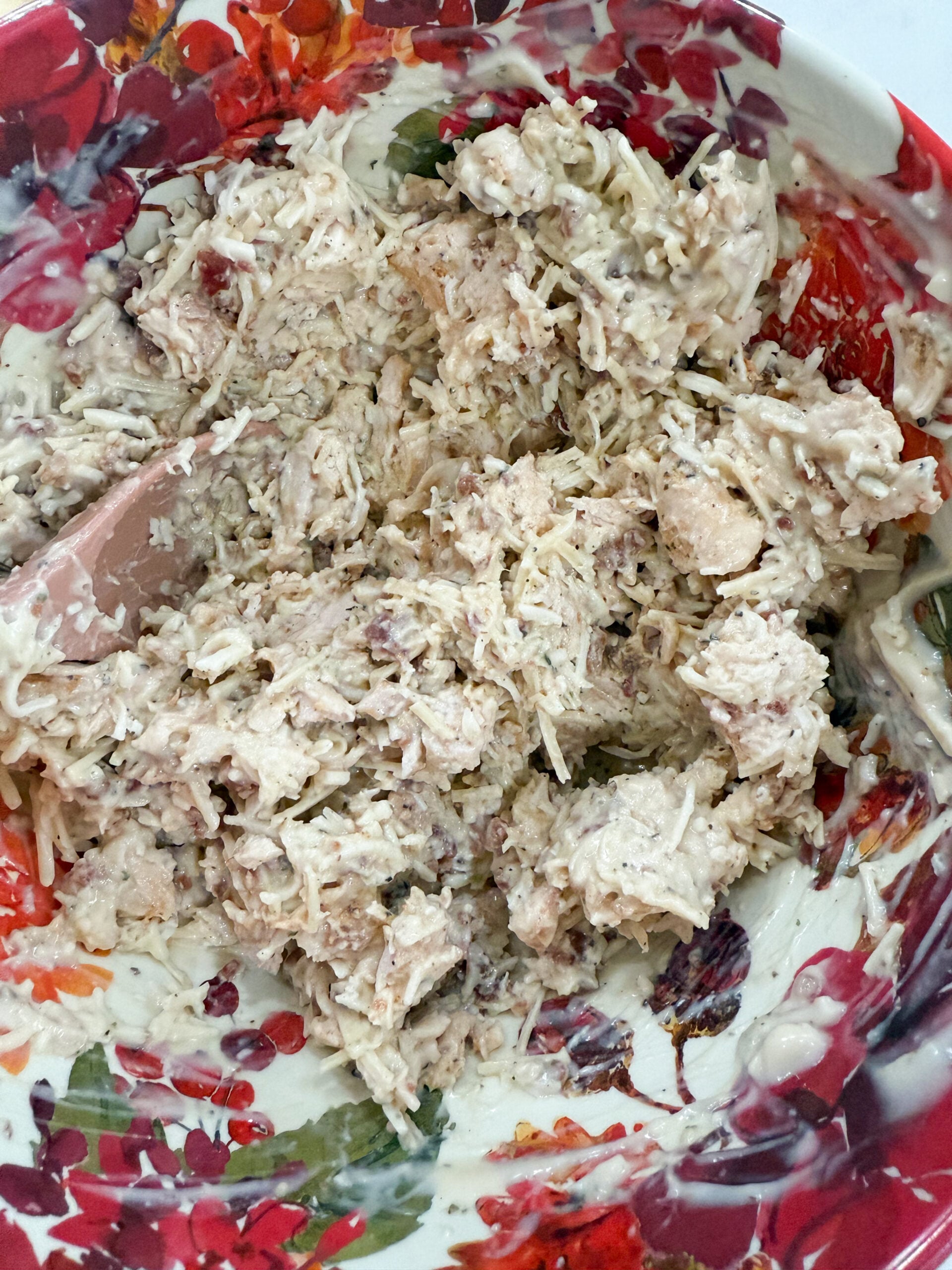 Chicken, Alfredo sauce, bacon, seasonings, Parmesan, and mozzarella in a mixing bowl