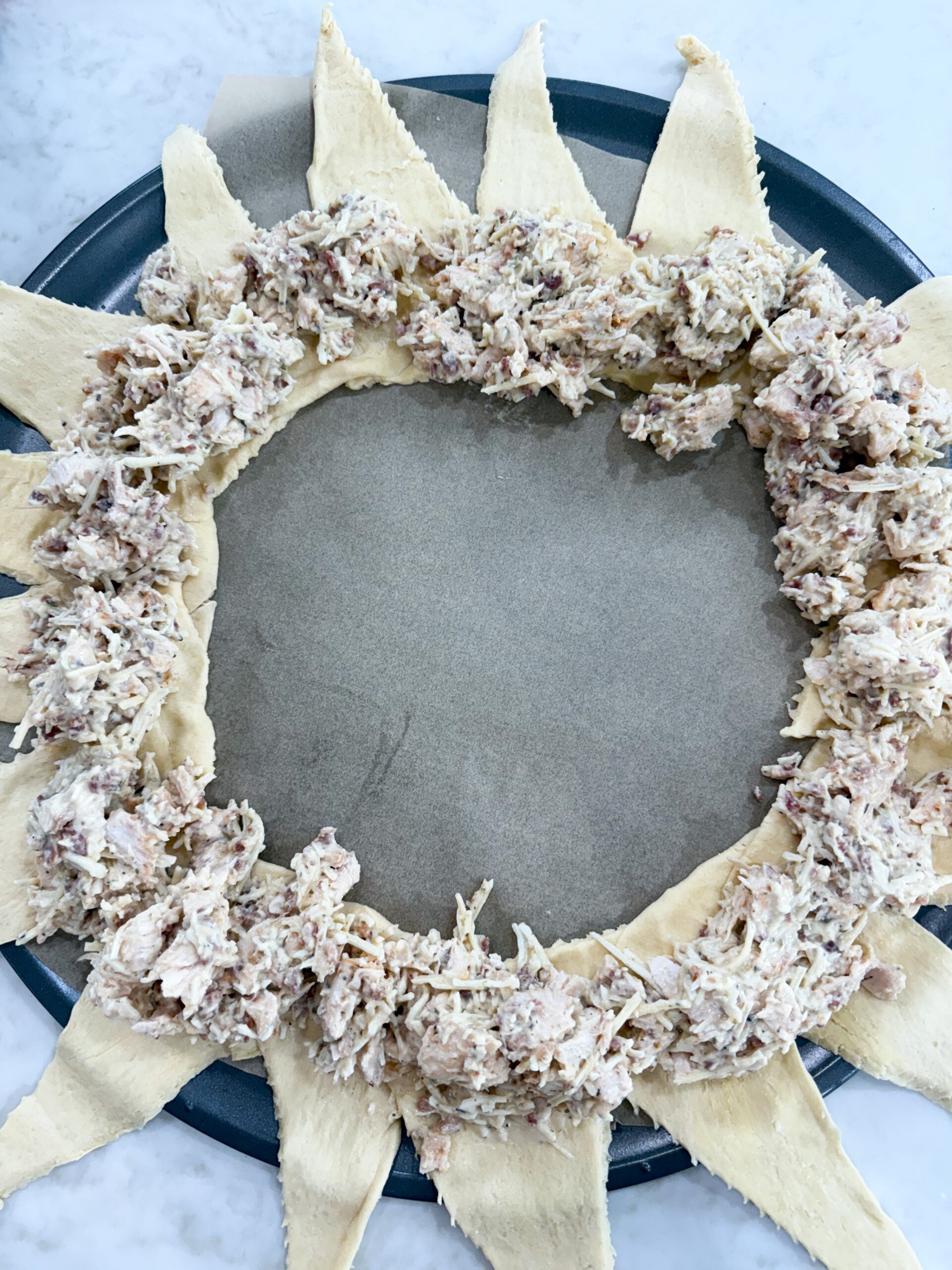 Chicken filling evenly around the circle over the overlapped ends.