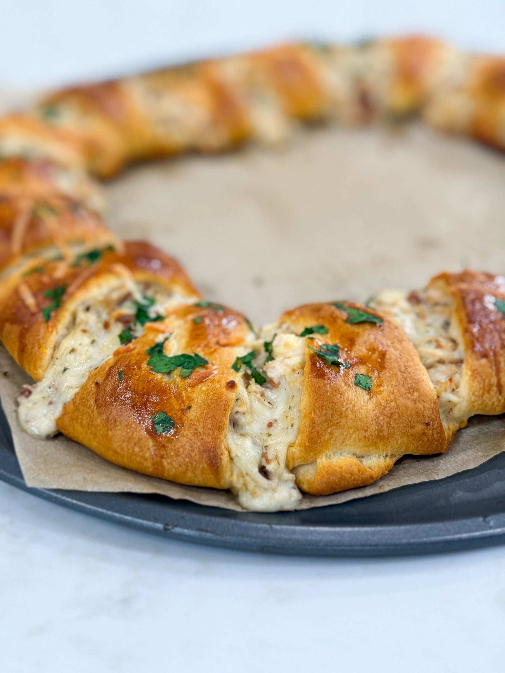 Golden crescent ring filled with chicken, bacon, and Alfredo sauce