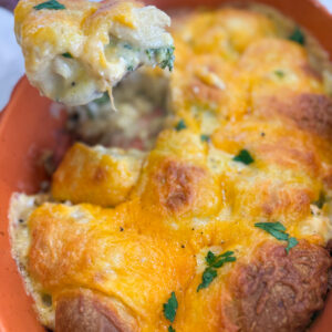 Golden brown cheesy chicken crescent roll casserole baked in a pan