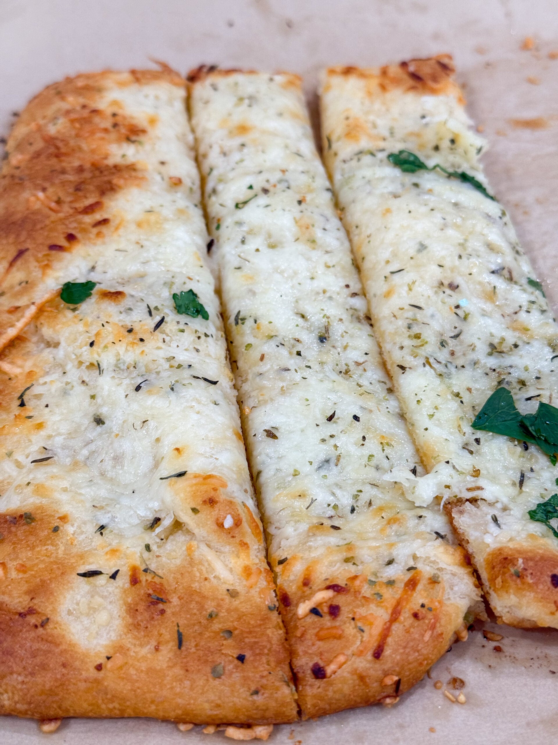 Golden baked cheesy garlic bread made with crescent dough