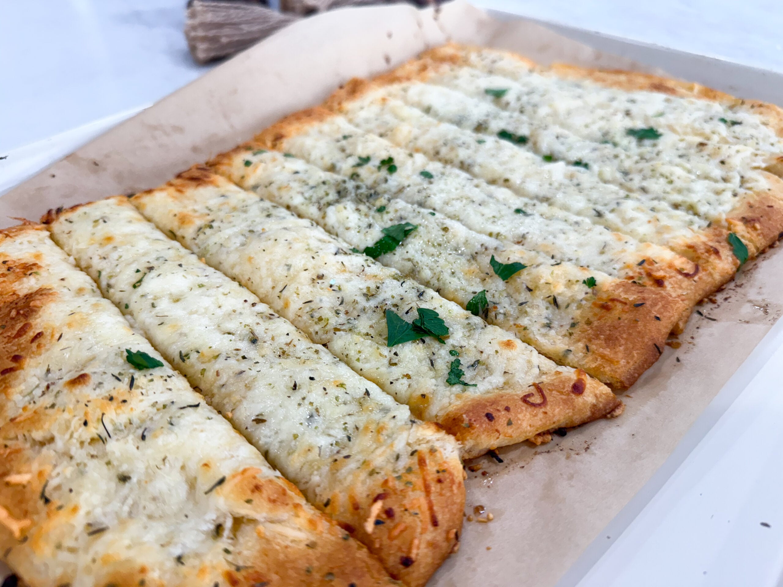 Golden baked cheesy garlic bread made with crescent dough on sheet pan