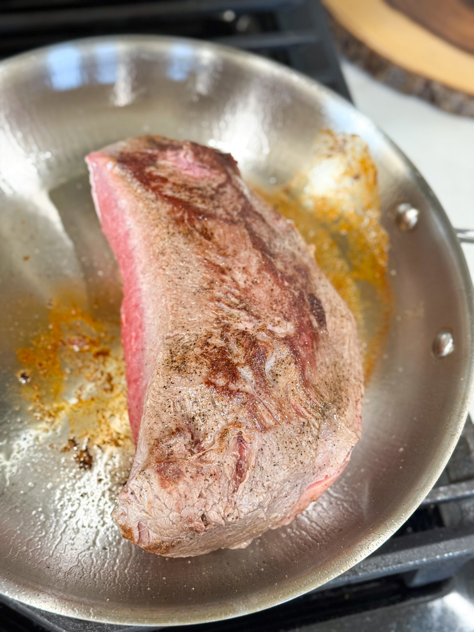 Searing beef roast in skillet for stroganoff