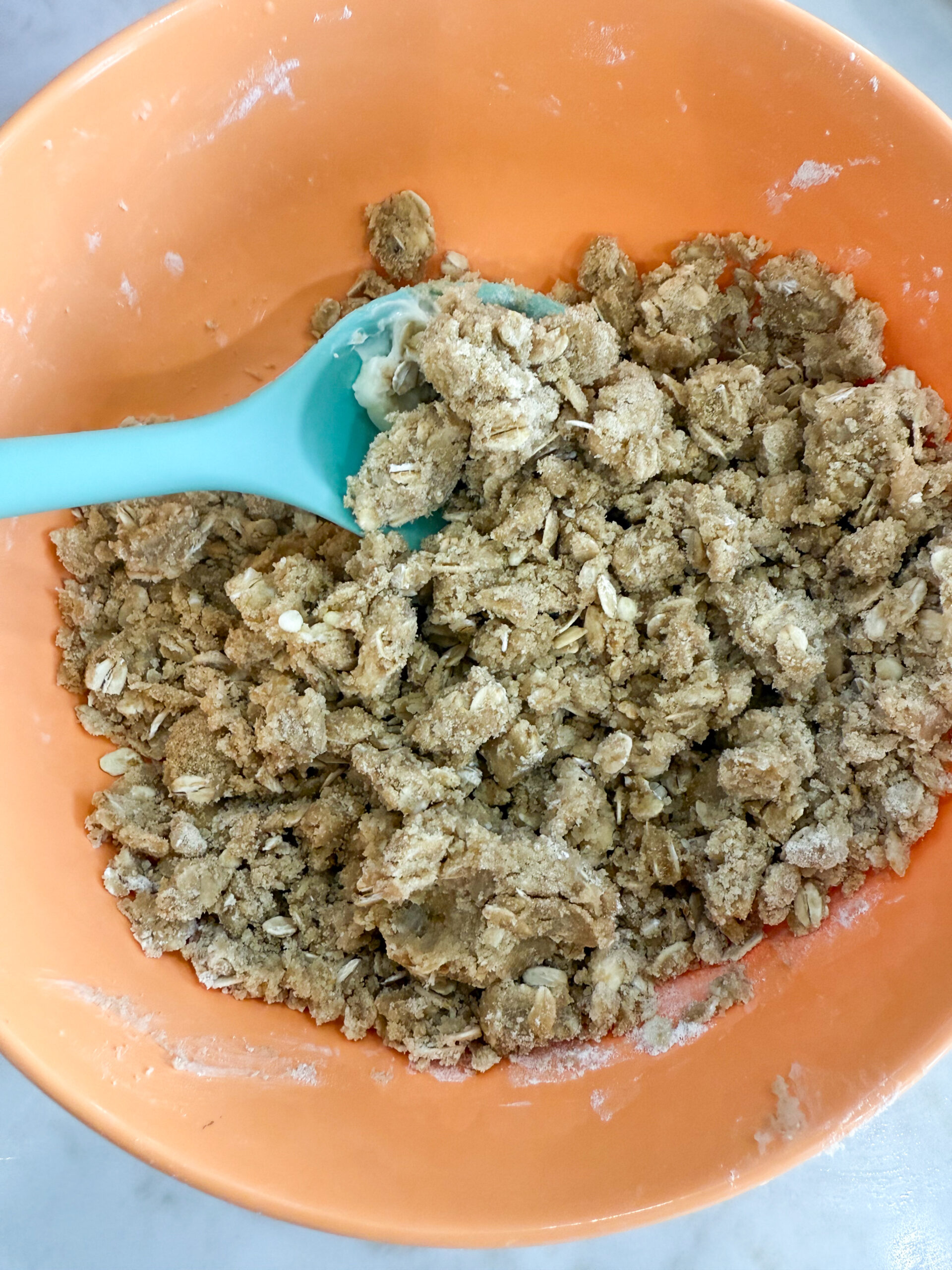 Oat and brown sugar crisp topping being mixed