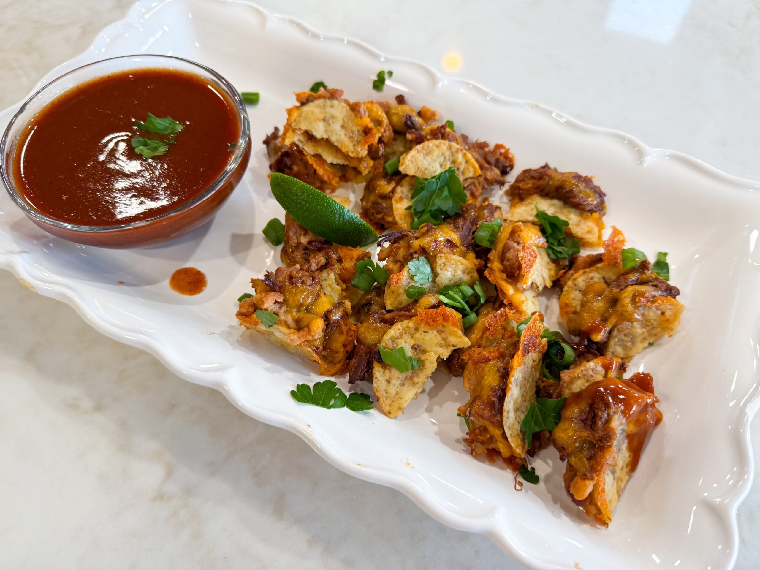 Tortilla chip tacos served on a plate