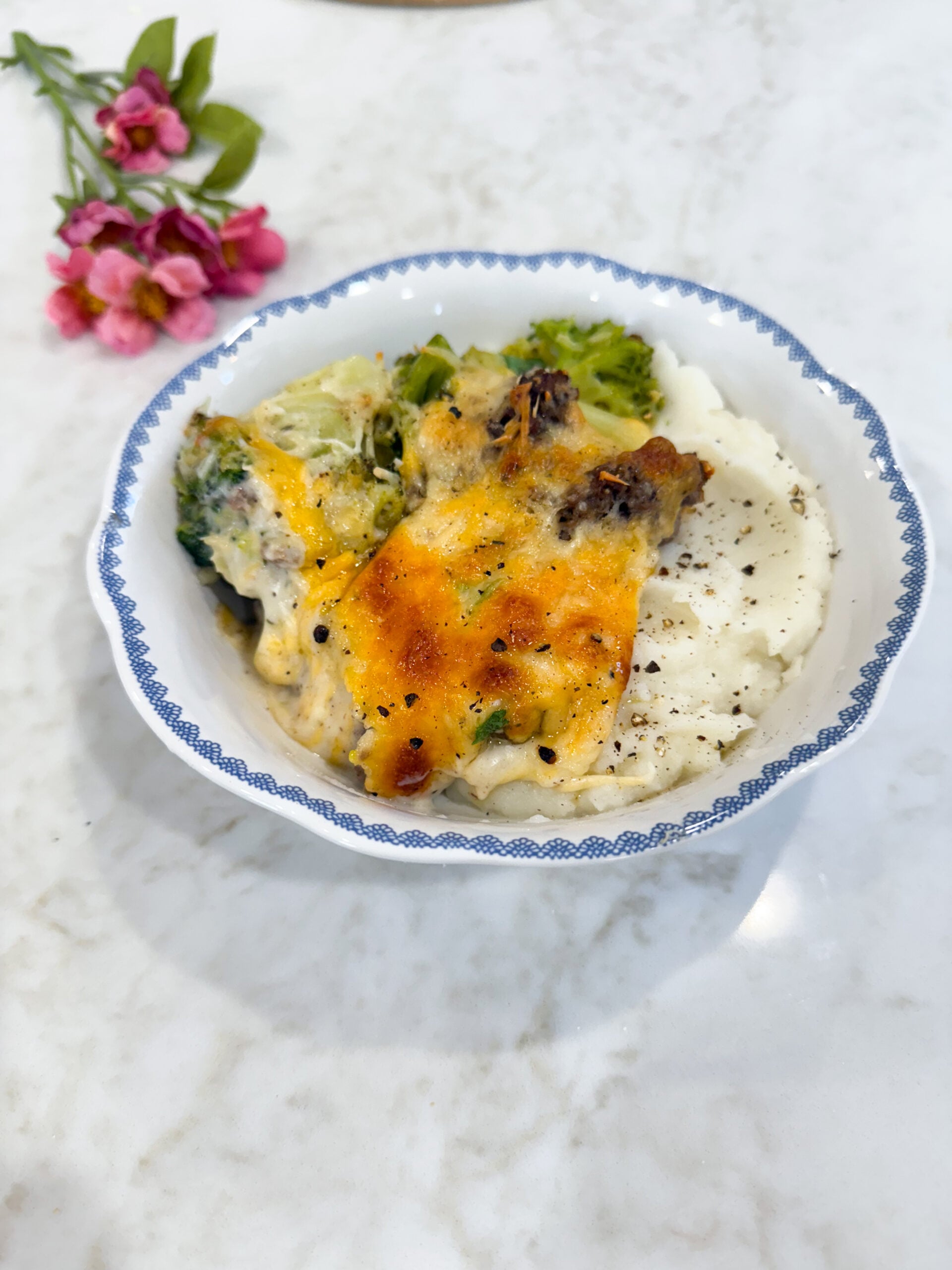 vertical photo of broccoli alfredo casserole serving
