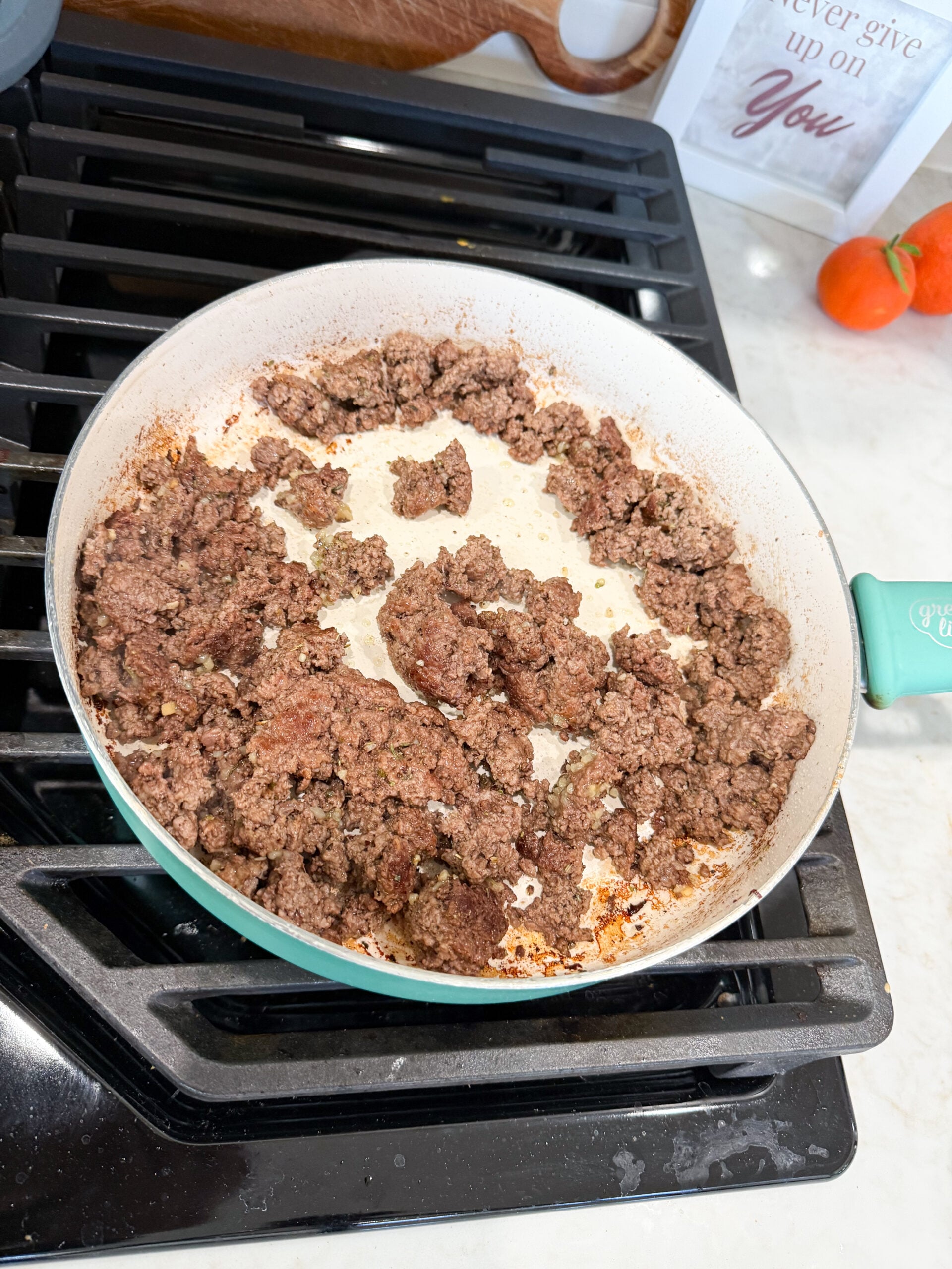 ground beef cooking in a skillet