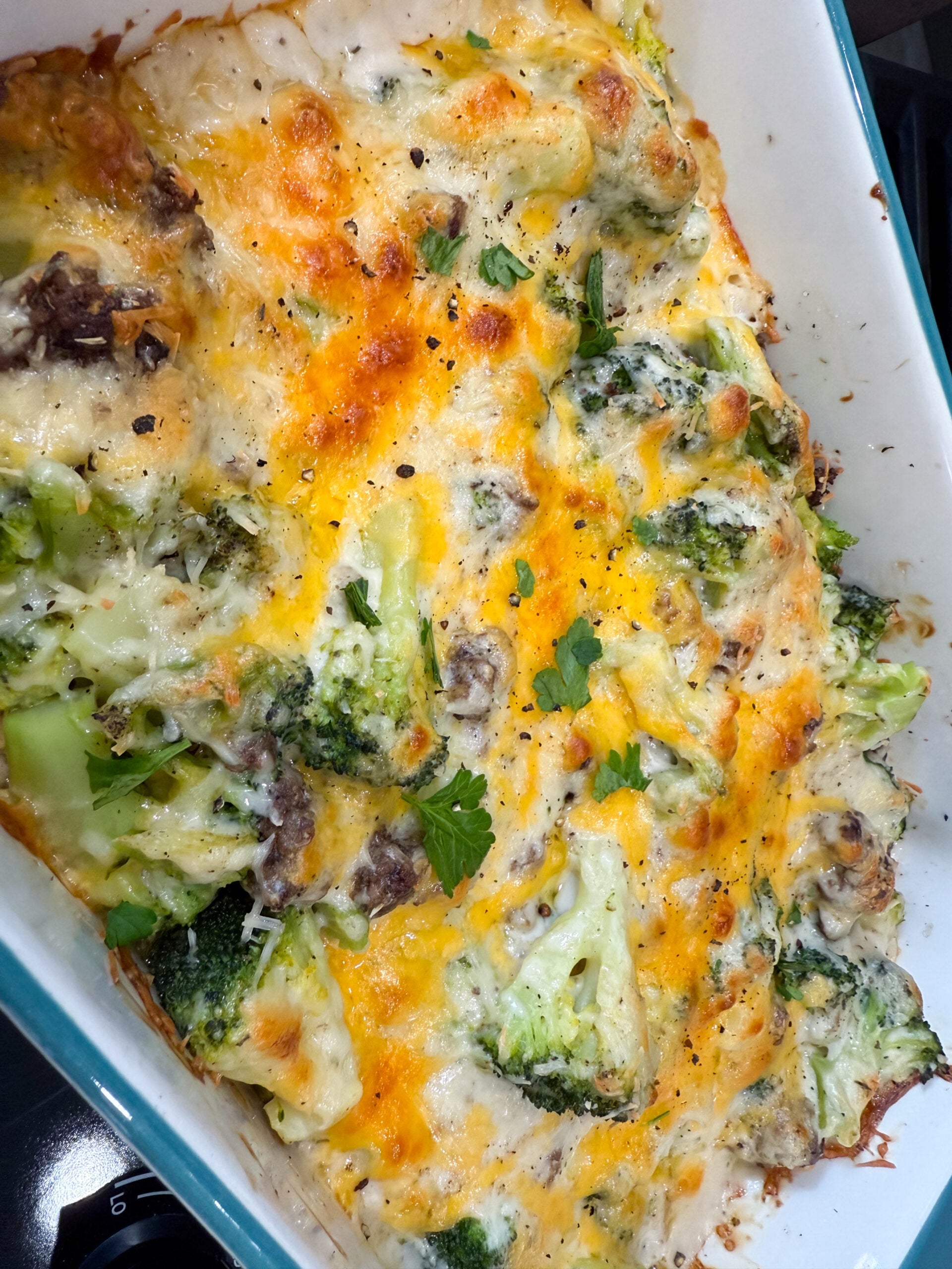 creamy broccoli alfredo casserole in a baking dish