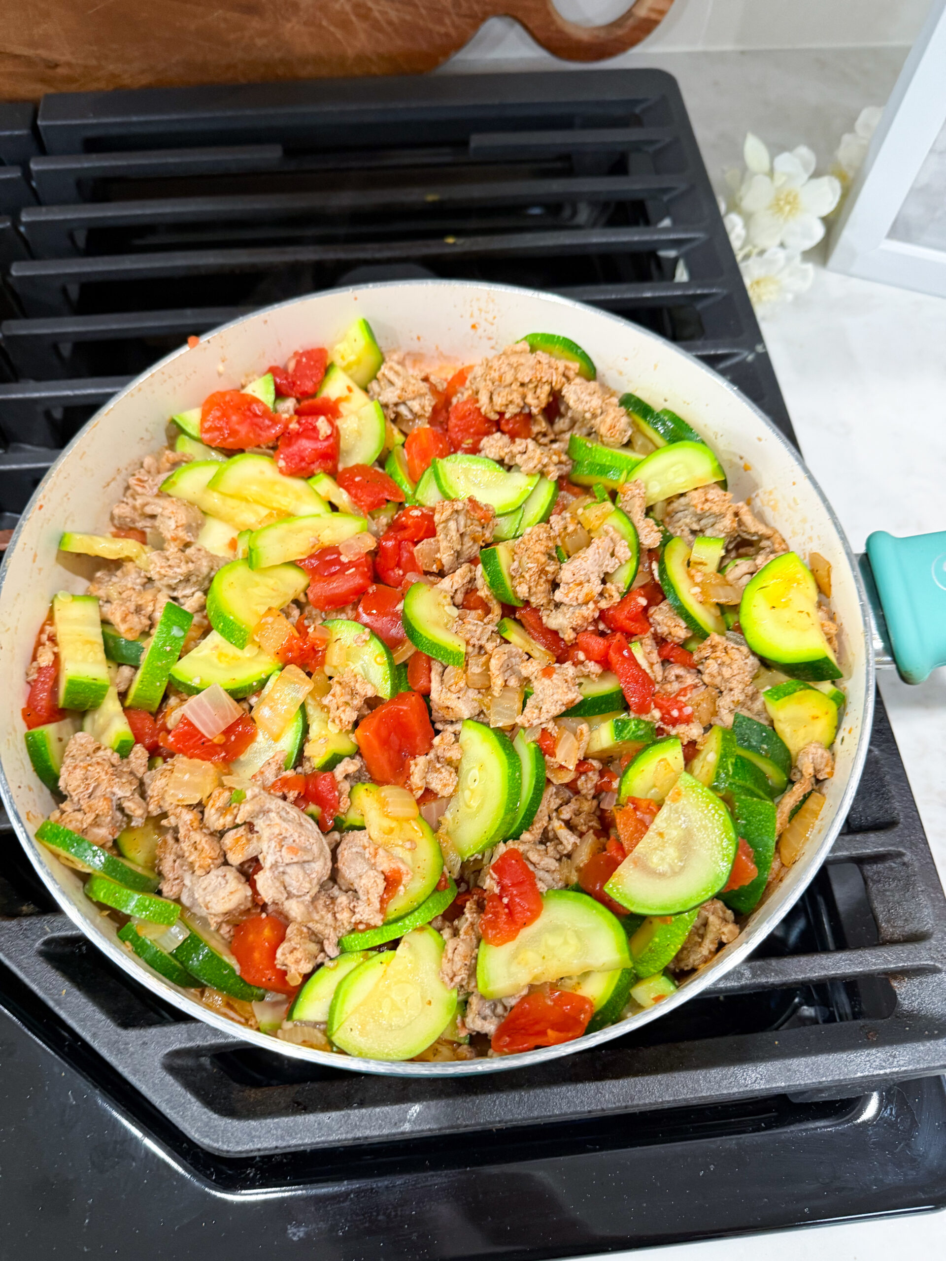 zucchini and tomatoes added to skillet