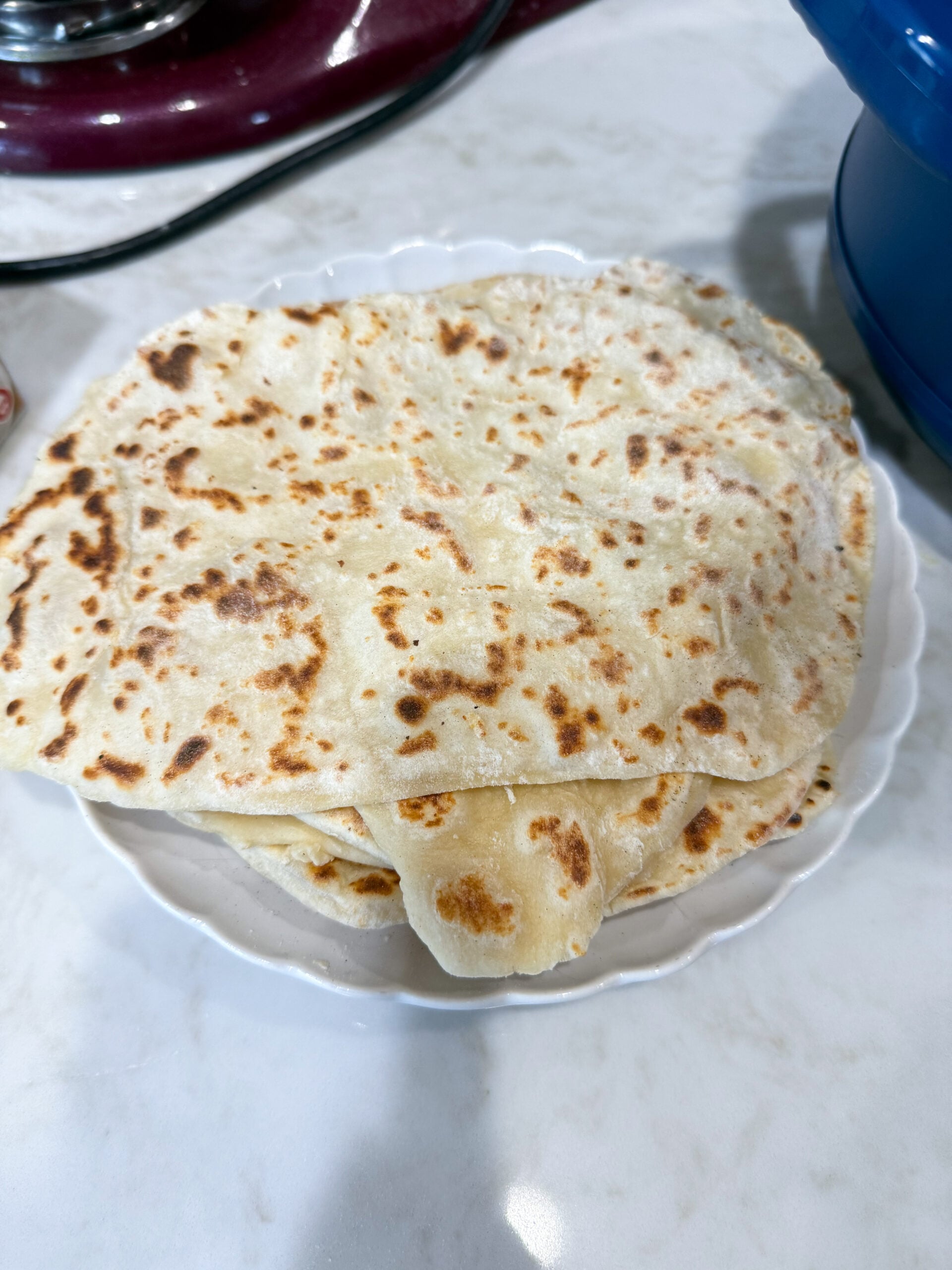 homemade naan bread stacked and ready to serve