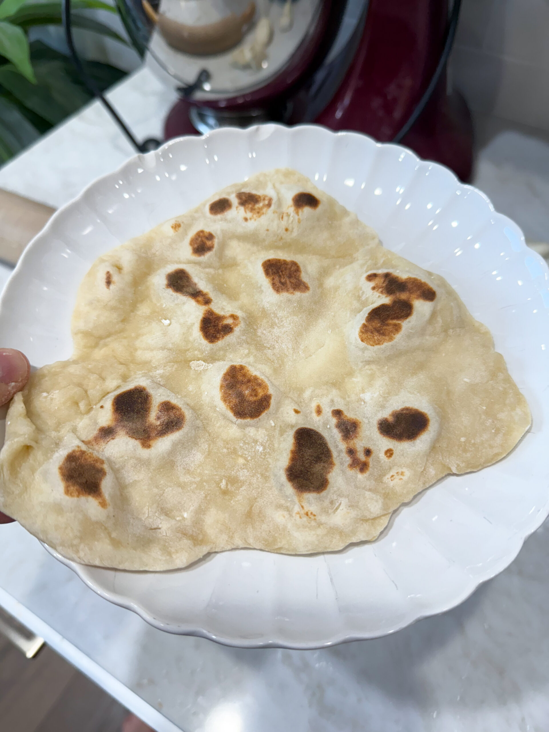 finished naan bread on a plate