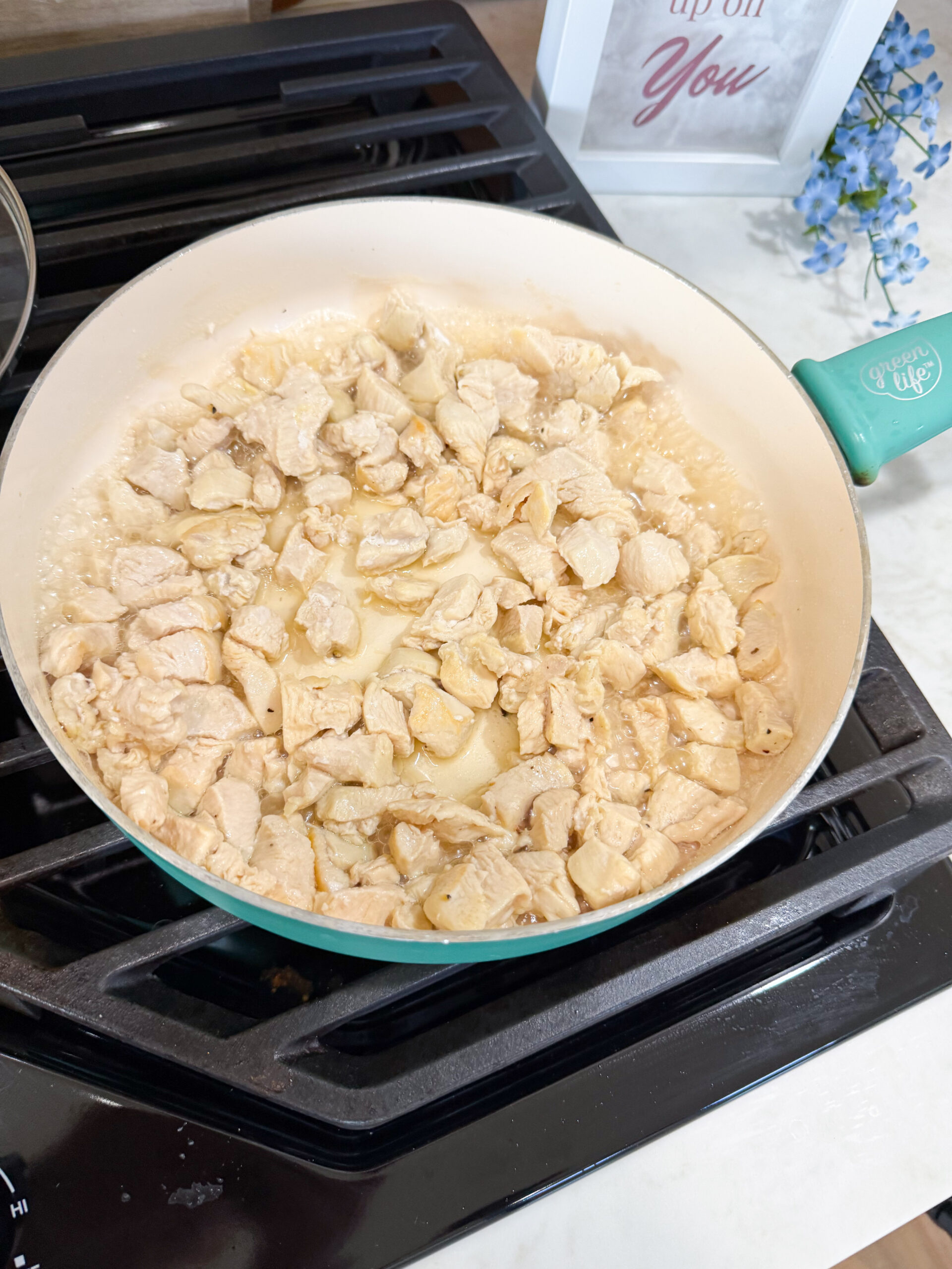 chicken cooking in skillet