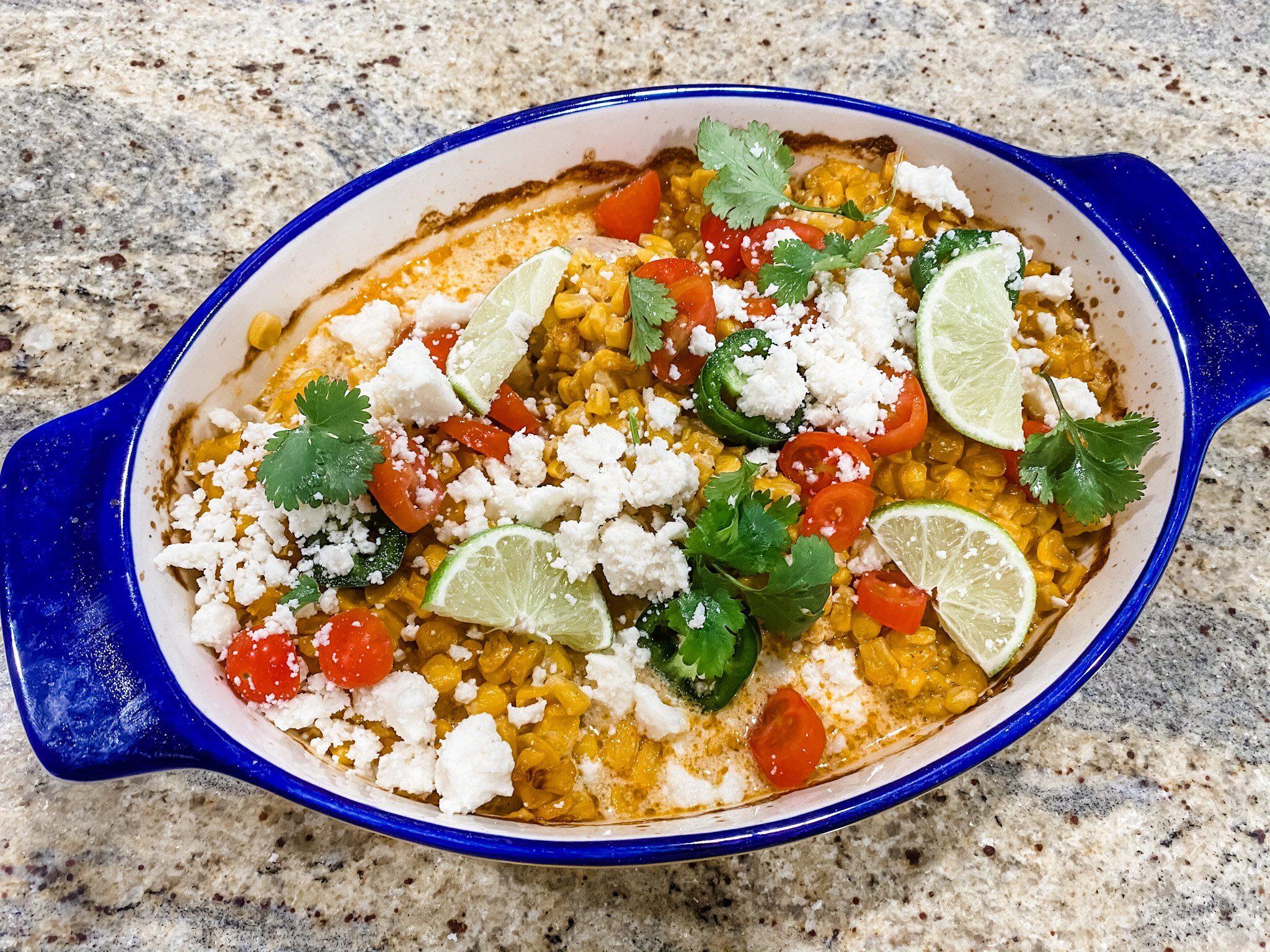 Baked street corn chicken topped with creamy corn mixture